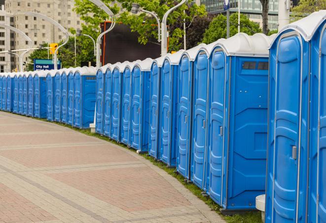 a line of portable restrooms at a sporting event, providing athletes and spectators with clean and accessible facilities in Bapchule AZ